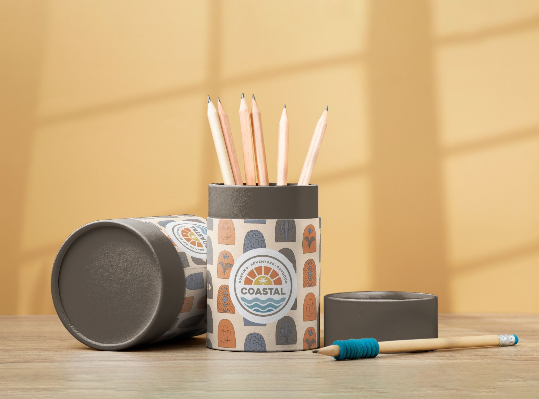 Custom cylindrical rigid box, with coastal theme logo, used for color pencils
